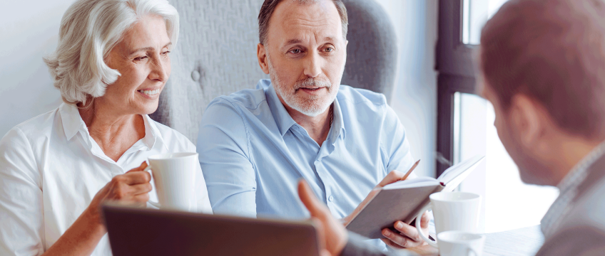 two people looking at laptop