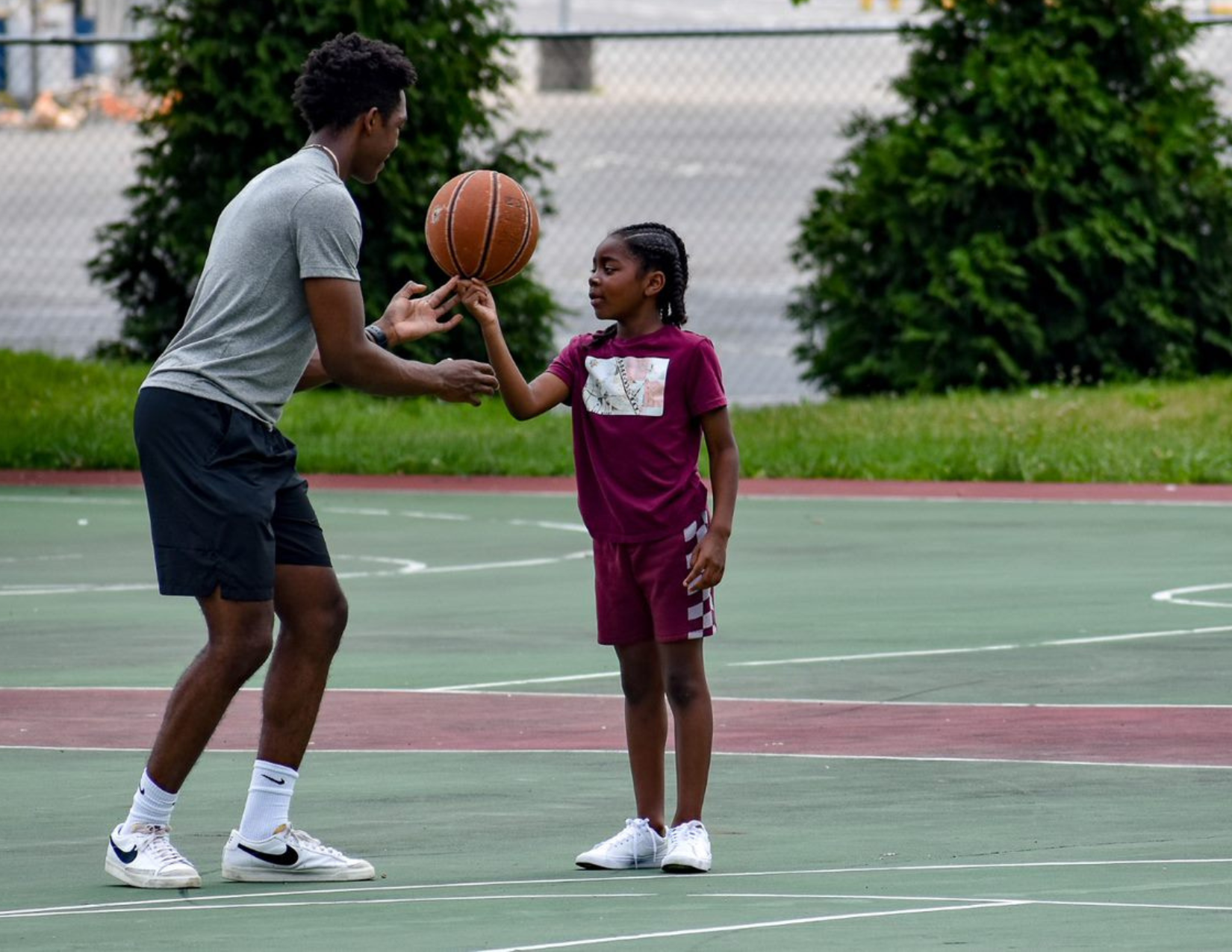 mentor and mentee playing basketball